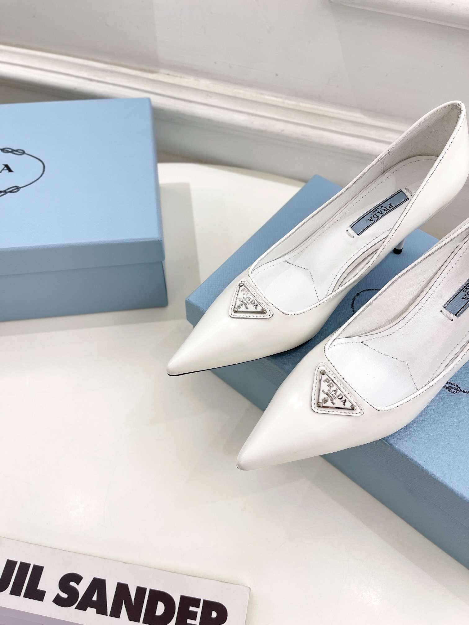 Pra*a Spike Pumps White For Women