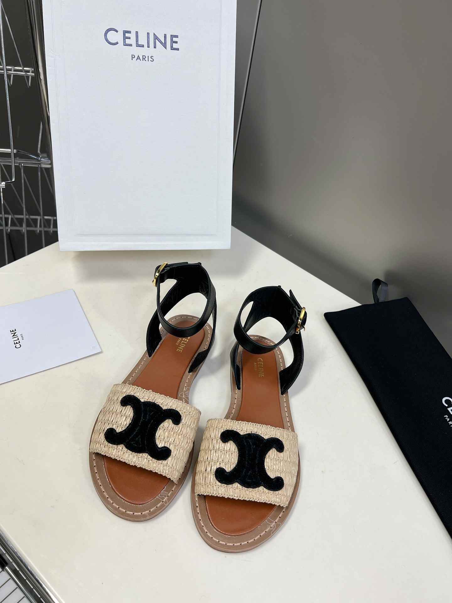 Ce1i*e Lympia Flat Strap Sandal In Raffia Black For Women 352402248C.02BL